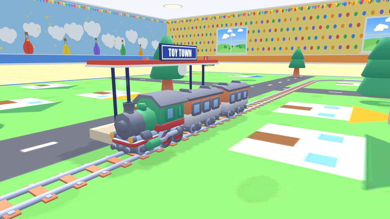 A green steam train stopped at the Toy Town station